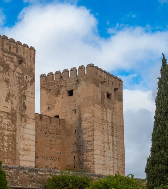 Alcazaba tower against blue sky