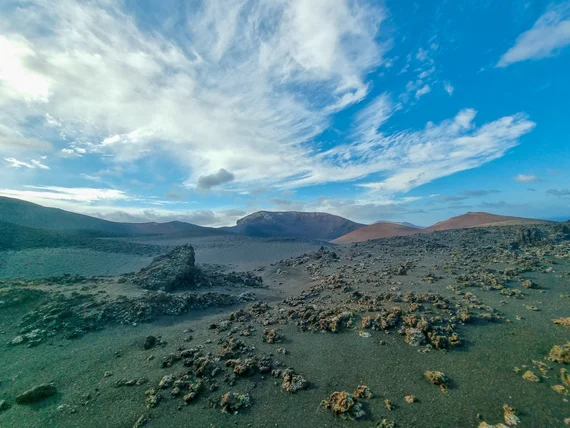 Volcanic landscape under dramatic clouds, Mars-like terrain