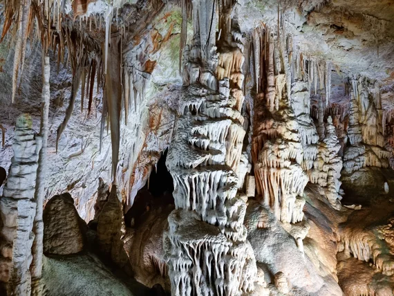 Elaborate layered stalactite and stalagmite column formations