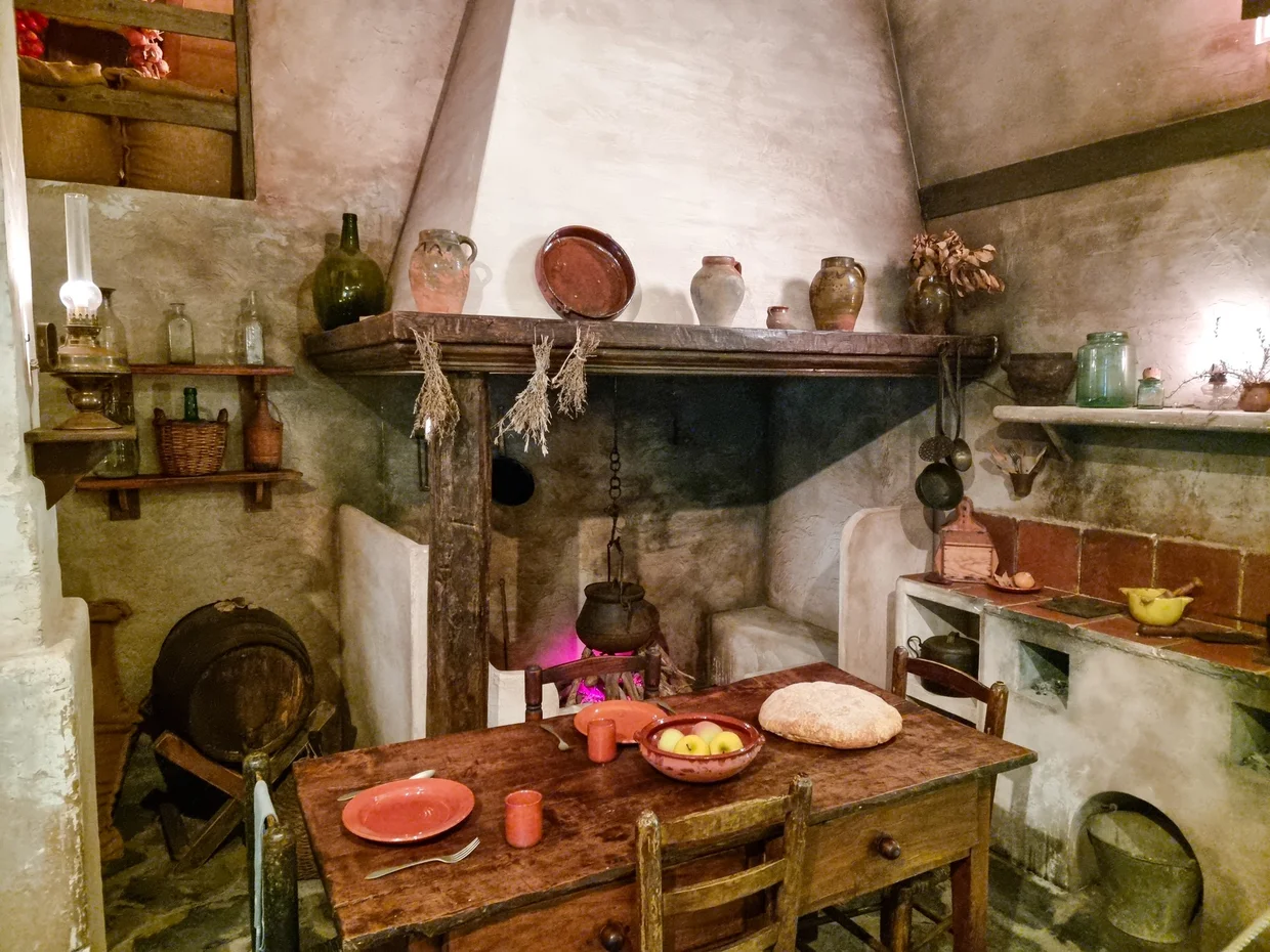 Traditional Mallorcan farmhouse kitchen with hearth and copper pots
