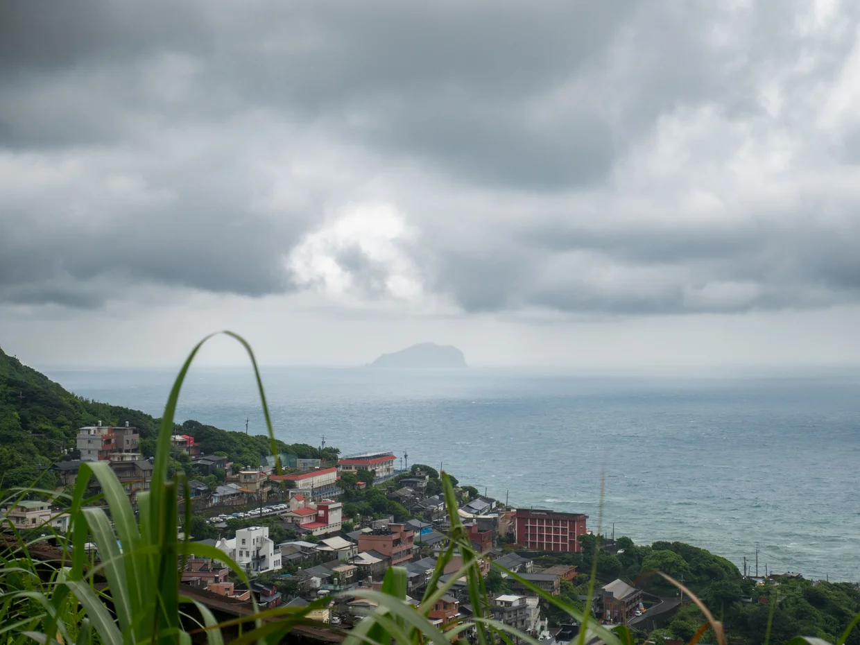 The Jiufen hillside and coast under heavy cloud