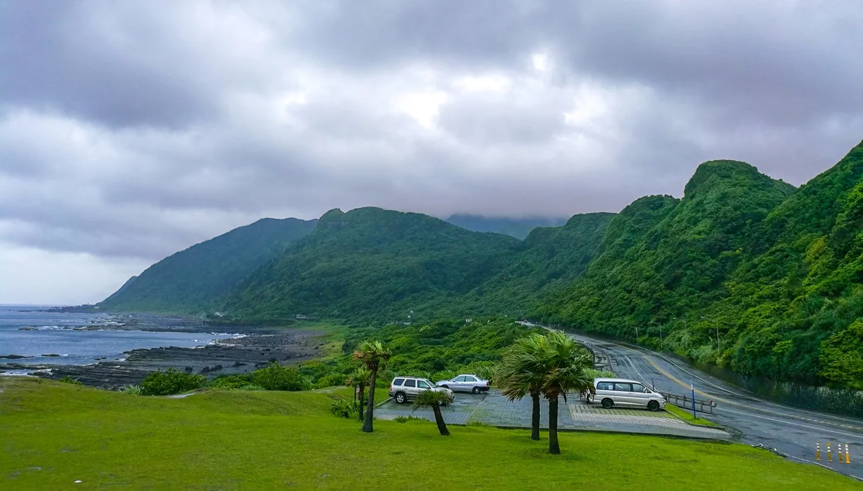 The coastal road curving along the northeast shore