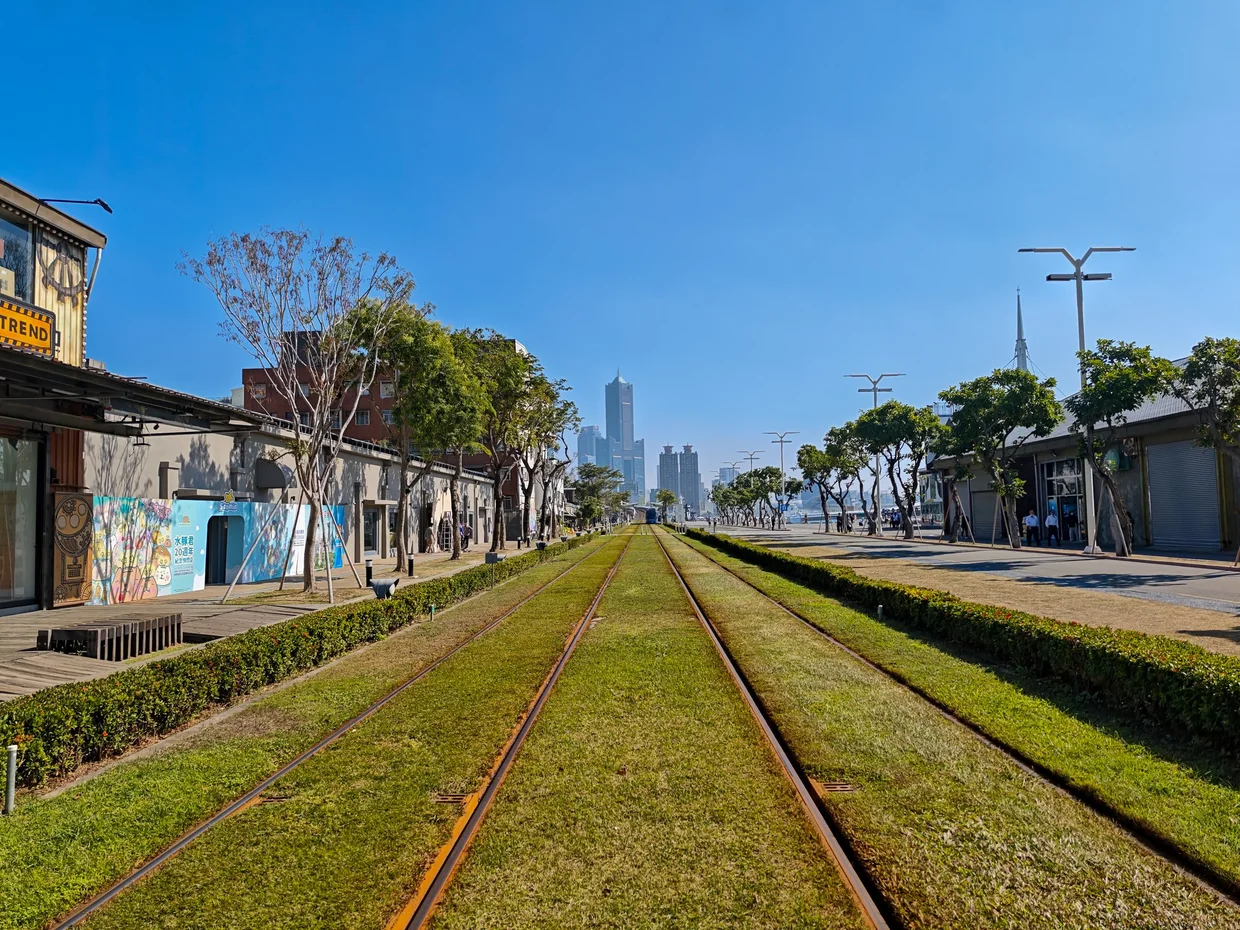Grass and rail lines leading into the harbor district