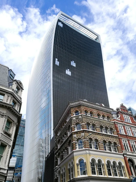 The Walkie Talkie skyscraper towering above ornate Victorian buildings