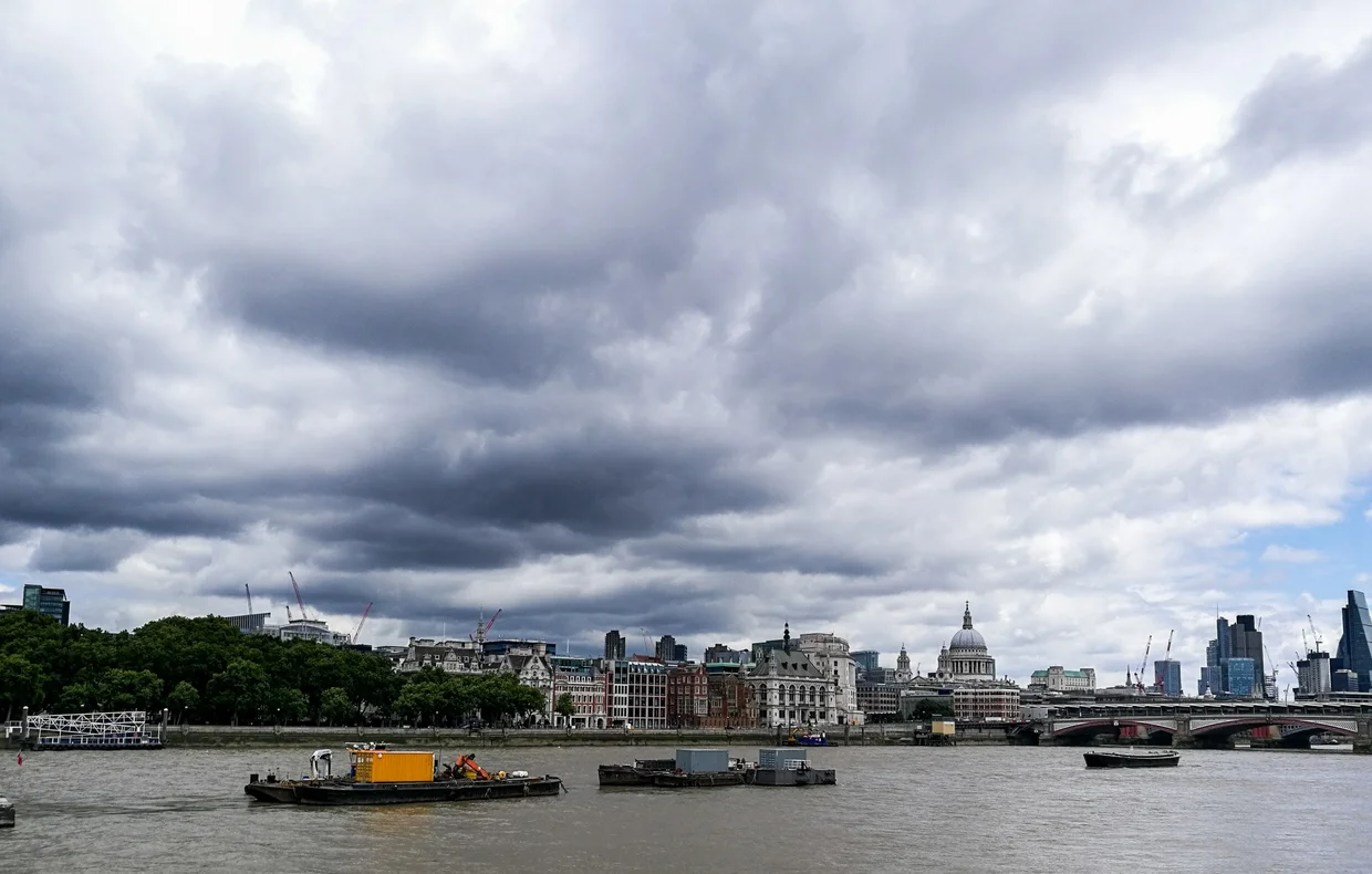 Thames panoramic with St Paul's Cathedral dome visible, dramatic storm clouds gathering