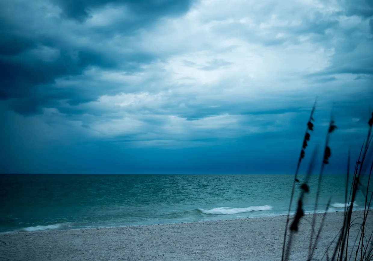 Storm clouds rolling in over a Gulf Coast beach