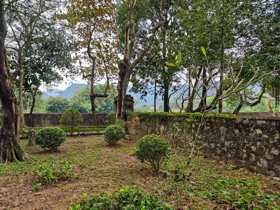 Quiet tree-lined garden area inside the Hoa Lu complex